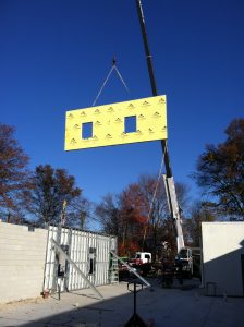 Crane lifting panels into place at Penn Valley Pump in Warrington