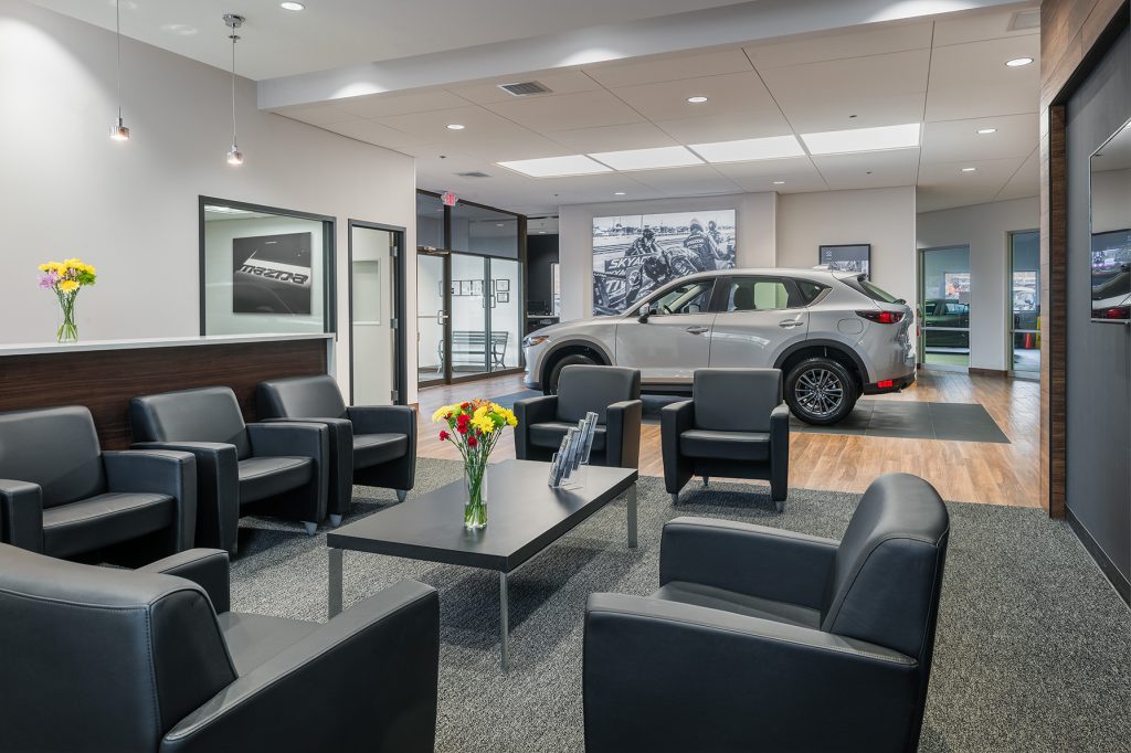 Interior of a modern Mazda car dealership 