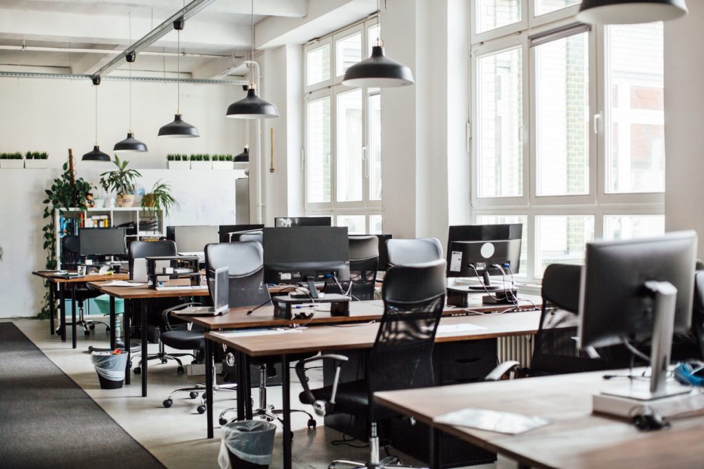 A modern office with rows of computers