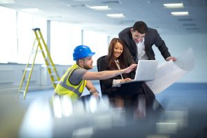 business people discuss office remodel with their contractor