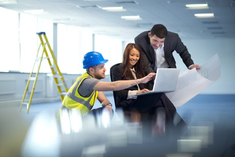 business people discuss office remodel with their contractor