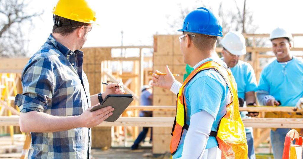 Foreman and contractor at a residential construction site