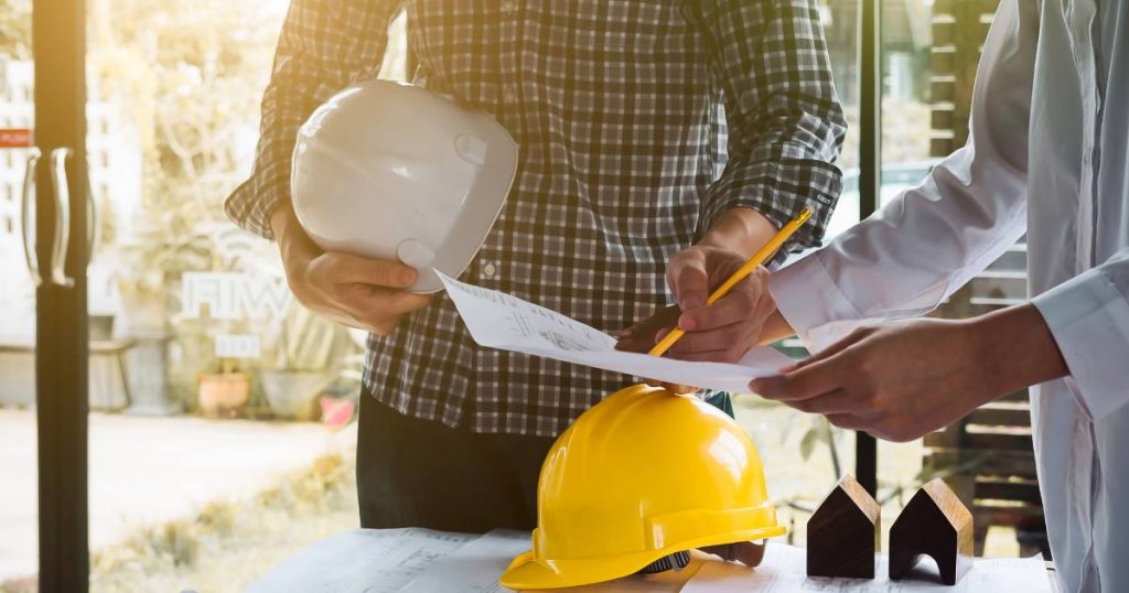 Commercial building owner working with contractor to reduce costs.